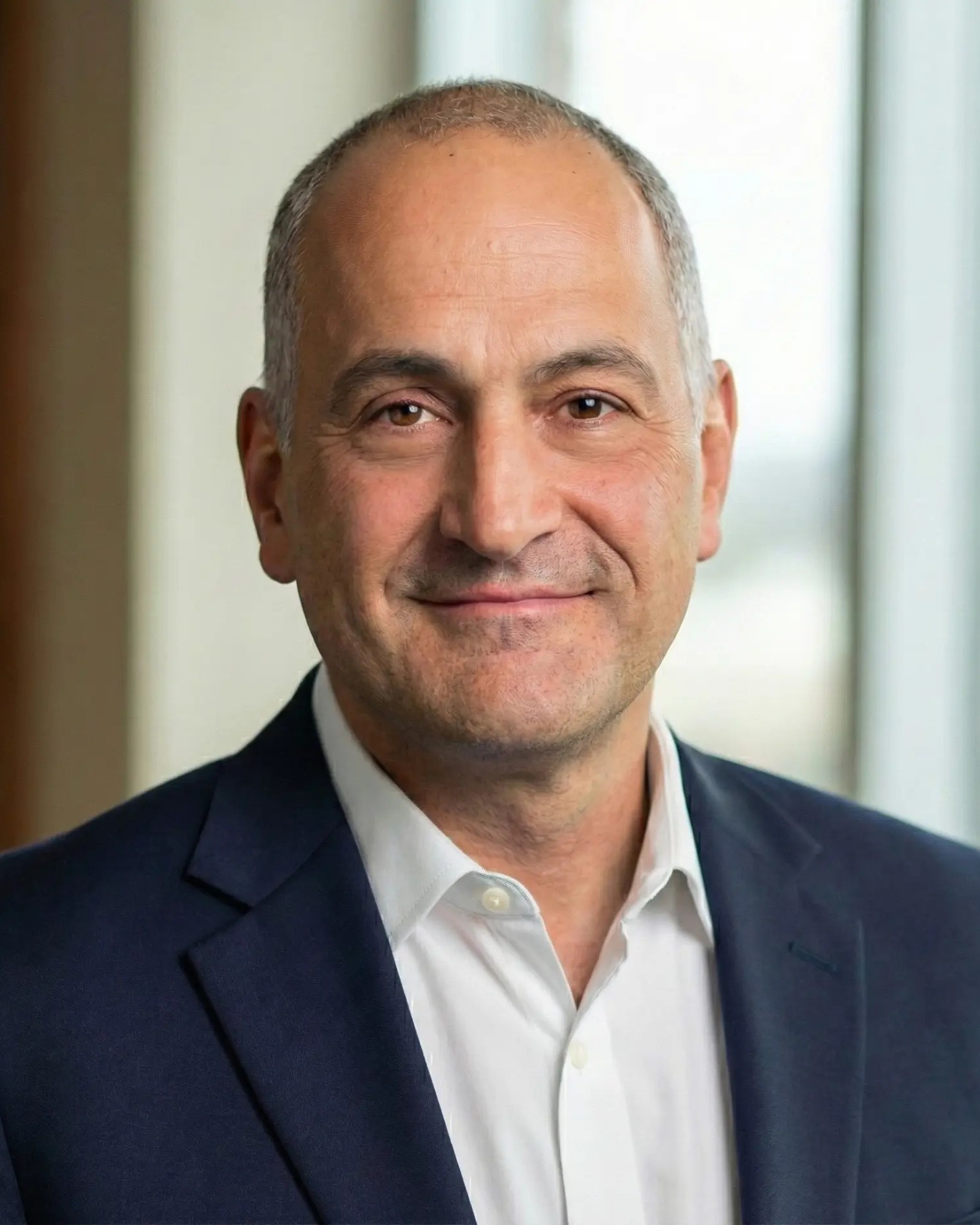 Eric Arzubi, MD, in a professional headshot.